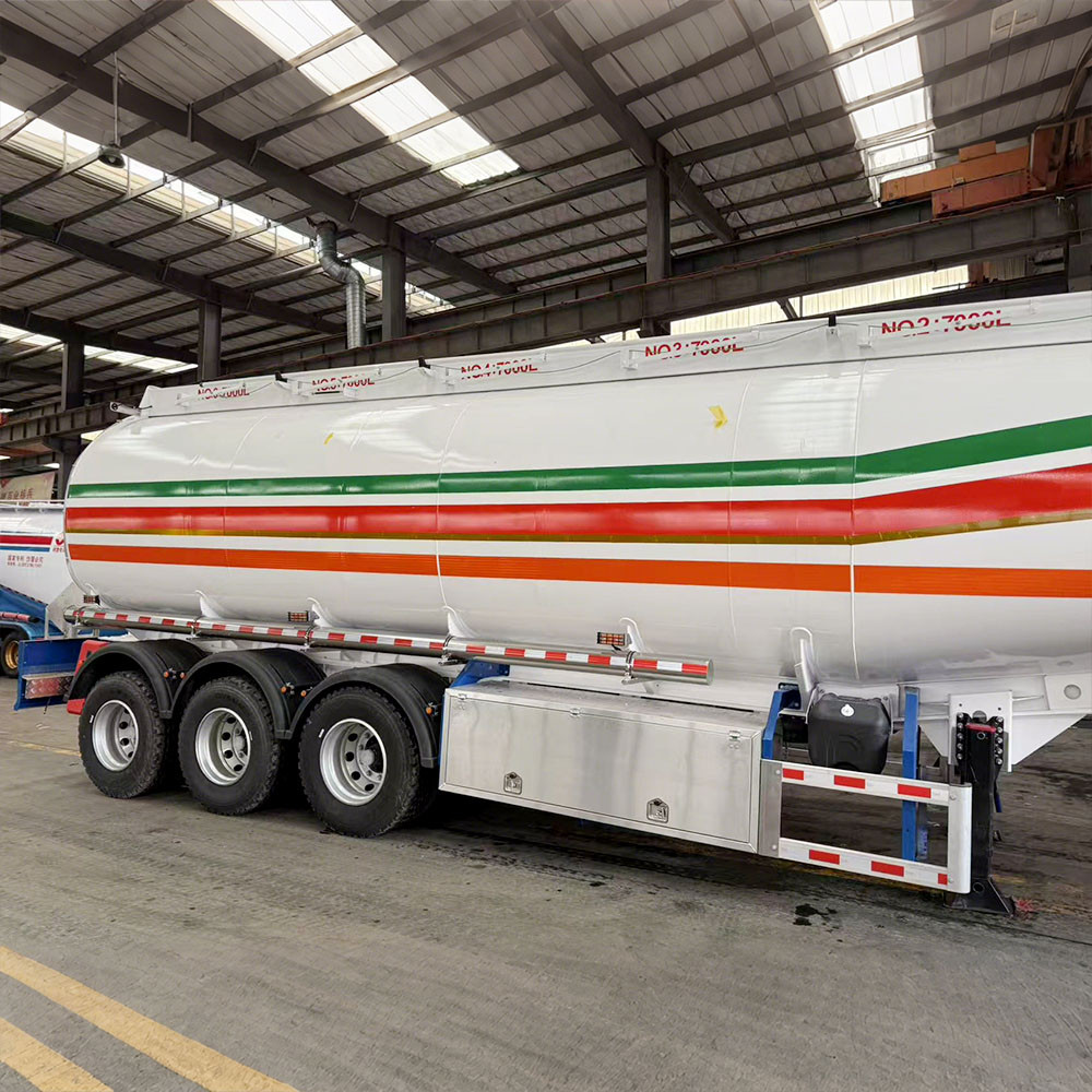 3 axle 45,000L aluminum fuel tanker semi trailer side view showing lightweight aluminum tank and suspension system