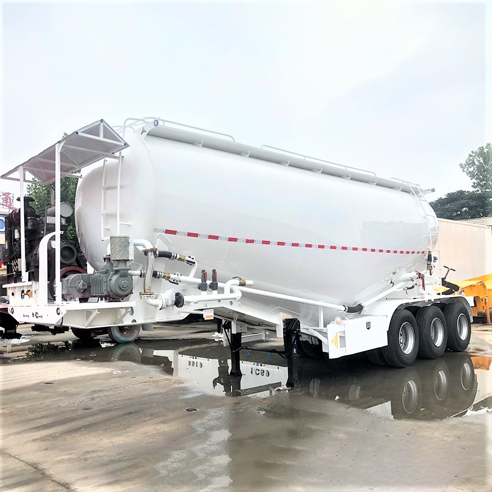 3 axle 40T cement bulk tanker trailer front three quarter view highlighting tank body and axle layout