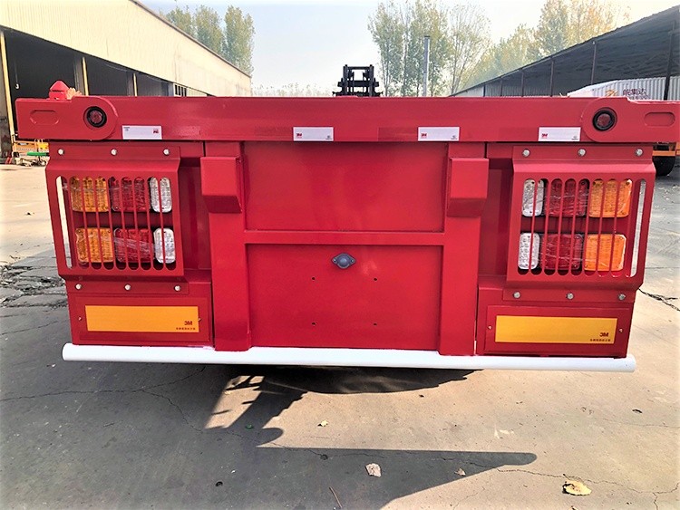 3 axle flatbed semi truck trailer rear view showing bumper and platform width