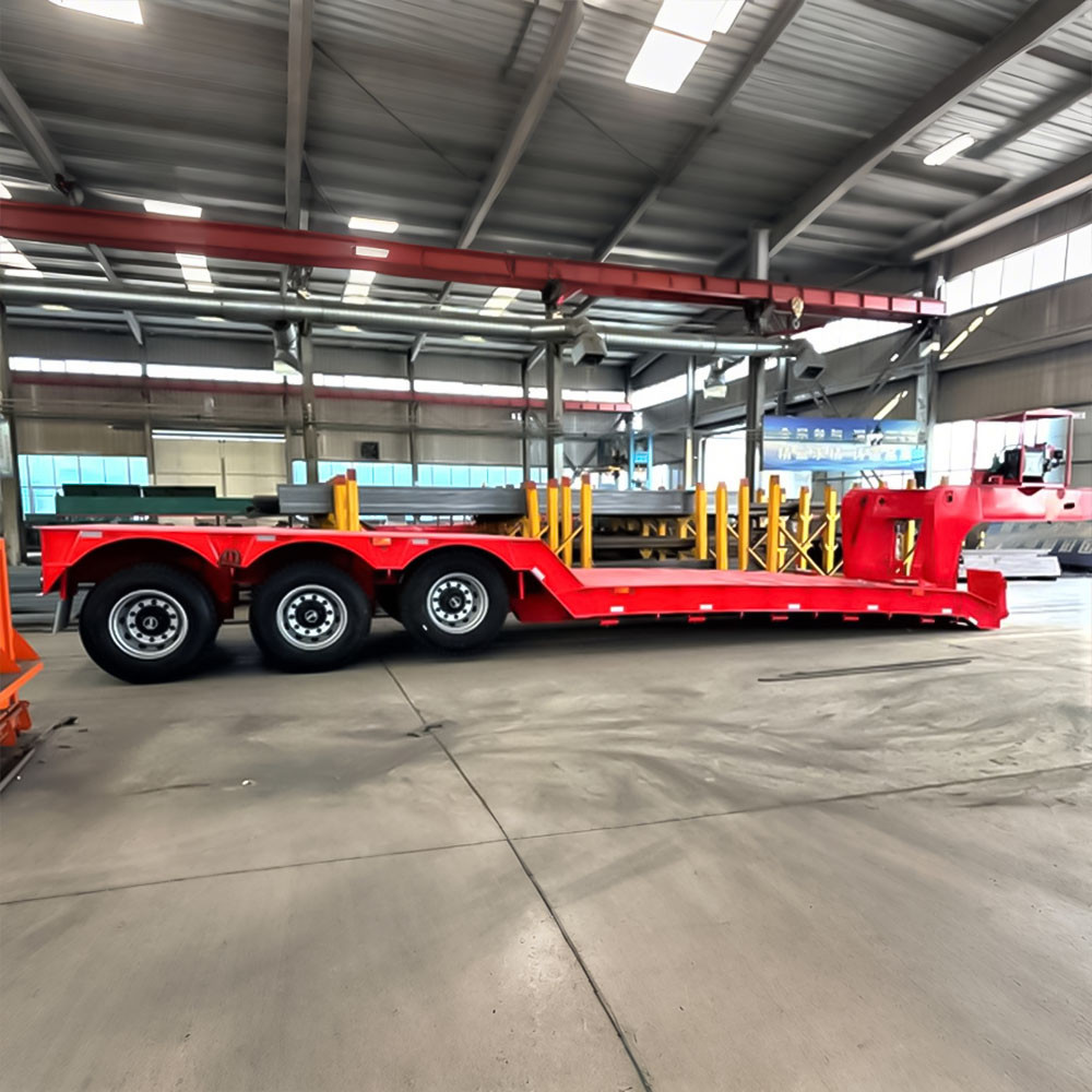 3 axle 80 ton removable gooseneck lowboy trailer side view showing extended low deck for heavy equipment transport