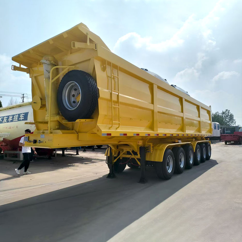 6 axle 40 ton dump semi trailer front three quarter view highlighting hydraulic lifting system and axle layout