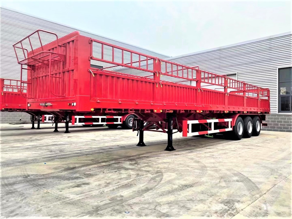 3 axle side wall cargo trailer front three quarter view highlighting side wall panels and three axle layout