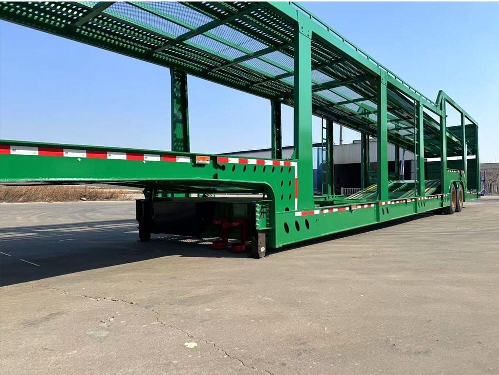 2 axle 8-car carrier trailer front three quarter view highlighting long vehicle transport platform and axle layout