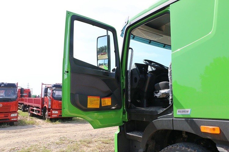 truck cabin door detail showing handle, lock system, and reinforced frame