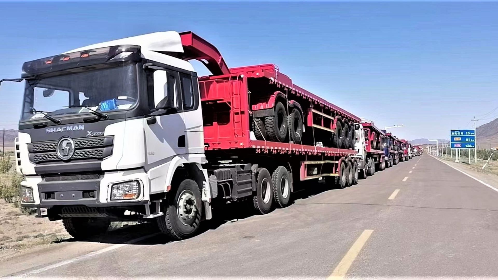 ZW Group logística de reboques semi-reboque plataforma: transporte terrestre confiável e carregamento com guindaste no porto para pedidos de exportação pesados.
