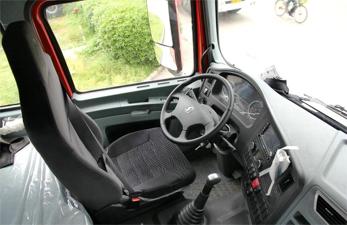 Shacman X3000 6x4 heavy duty tractor truck steering wheel detail with multifunction controls