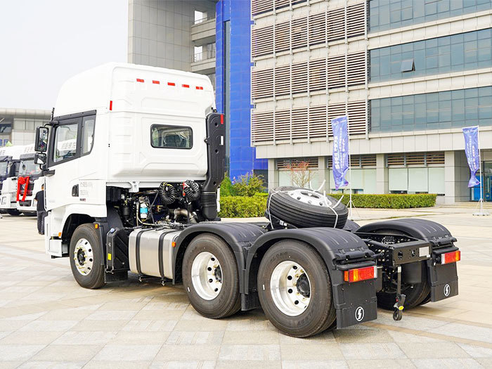 Shacman X5000 6x4 heavy duty tractor truck rear three quarter view showing fifth wheel and rear frame
