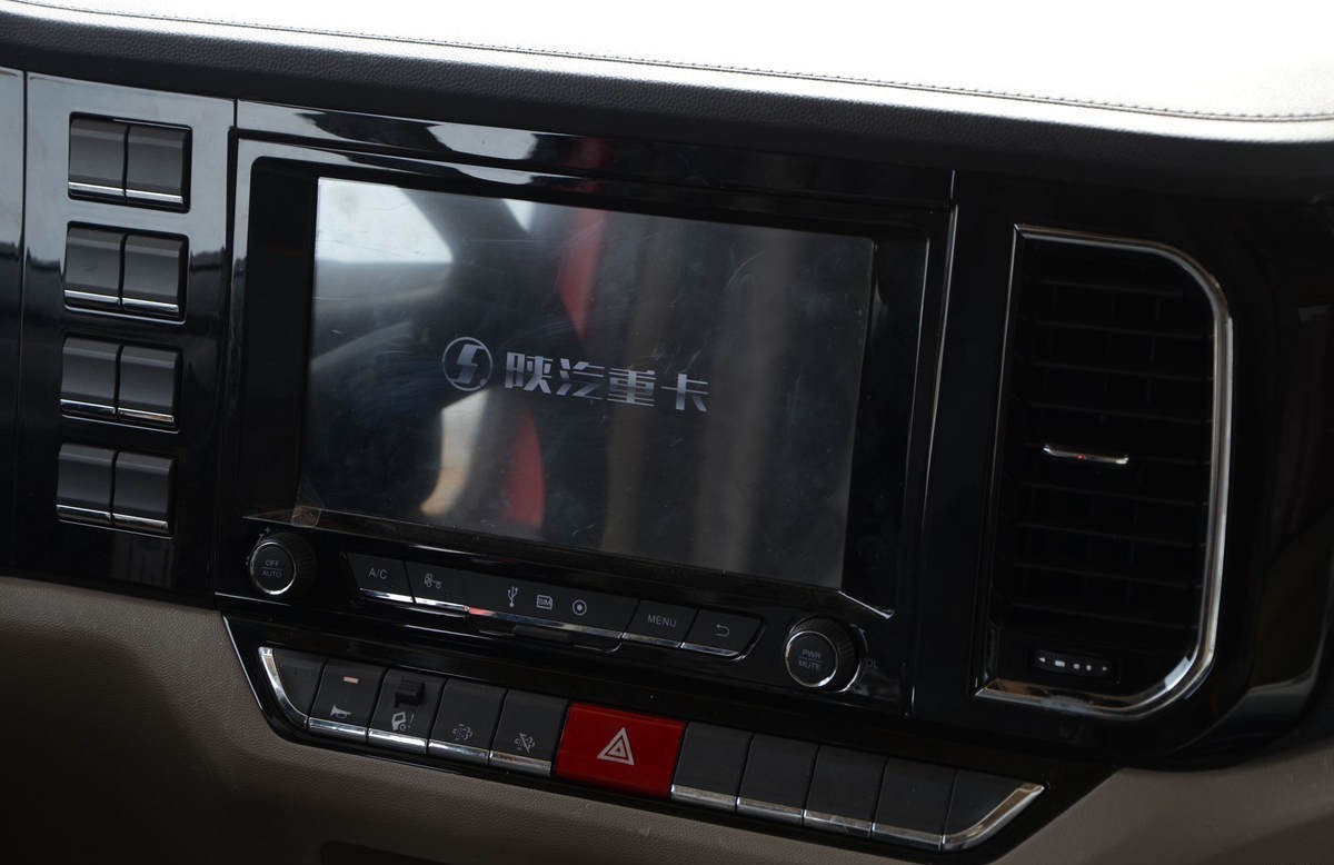 Shacman L5000 4x2 heavy duty cargo truck cabin interior showing ergonomic layout and driver comfort