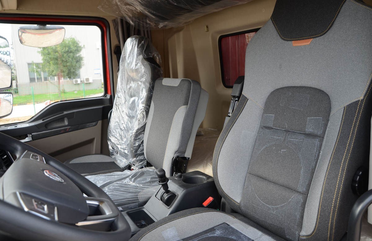 Shacman L5000 4x2 heavy duty cargo truck cabin interior showing ergonomic layout and driver comfort