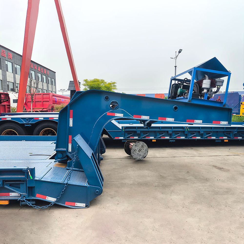 3 axle 60 ton RGN lowboy trailer gooseneck detail showing reinforced structure for heavy load bearing
