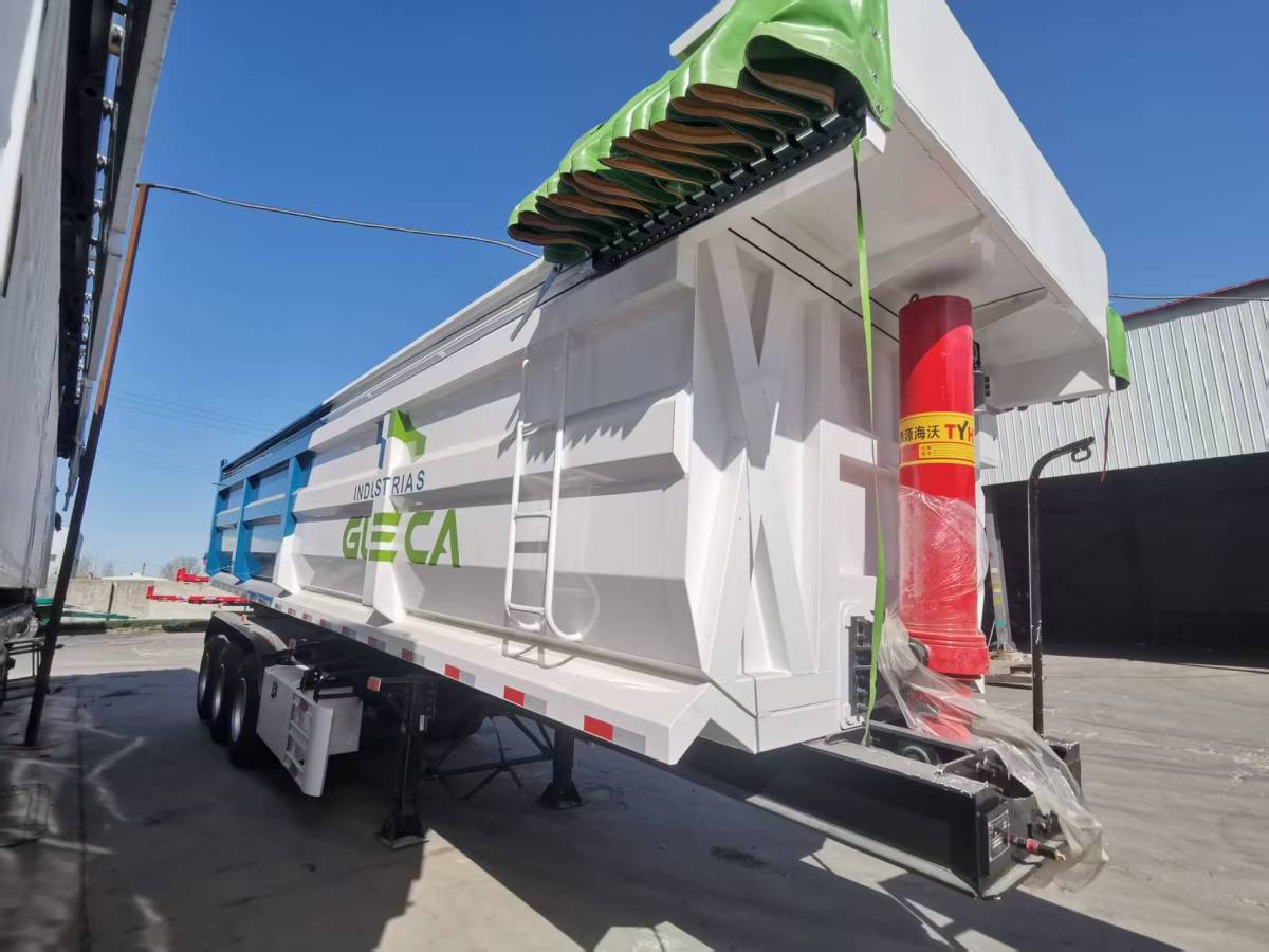 3 axle 30CBM U dump trailer front three quarter view highlighting hydraulic cylinder and axle layout