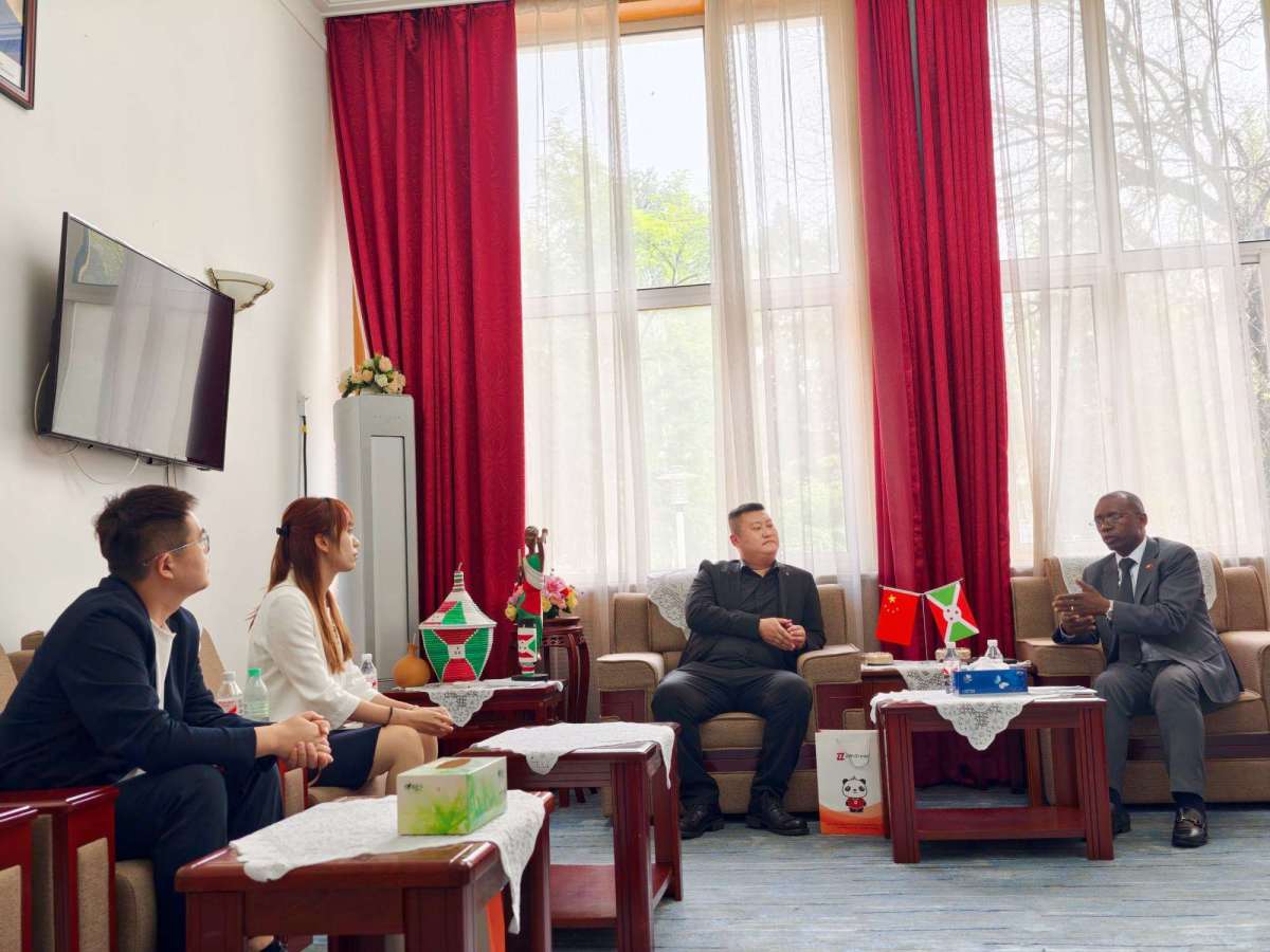 ZW Group Chairman Ivan Sun (Sun Yongchang), General Manager Pierce Guo, and Secretary-General Vera Jiang with Burundi Ambassador H.E. Telesphore Irambona during a high-level cooperation meeting in Beijing on trucks, trailers and construction machinery