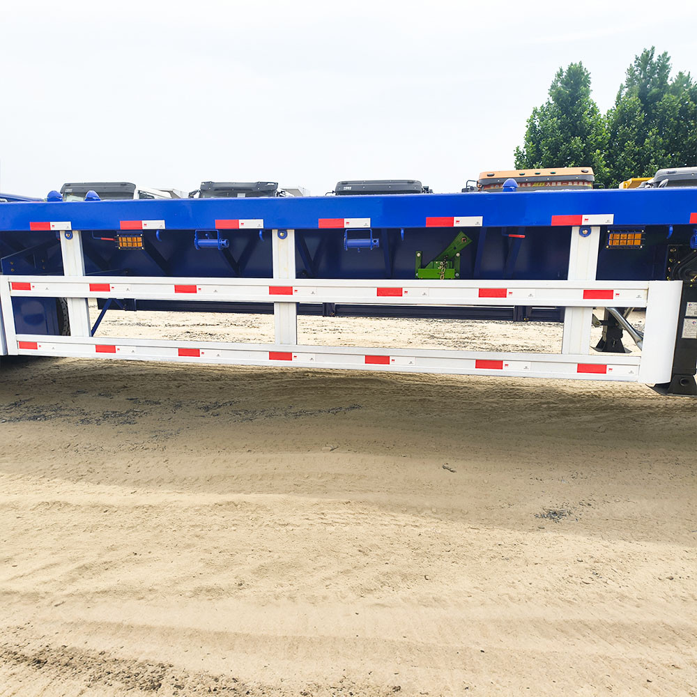Side protection guard and container twist locks on 40ft cargo transport trailer