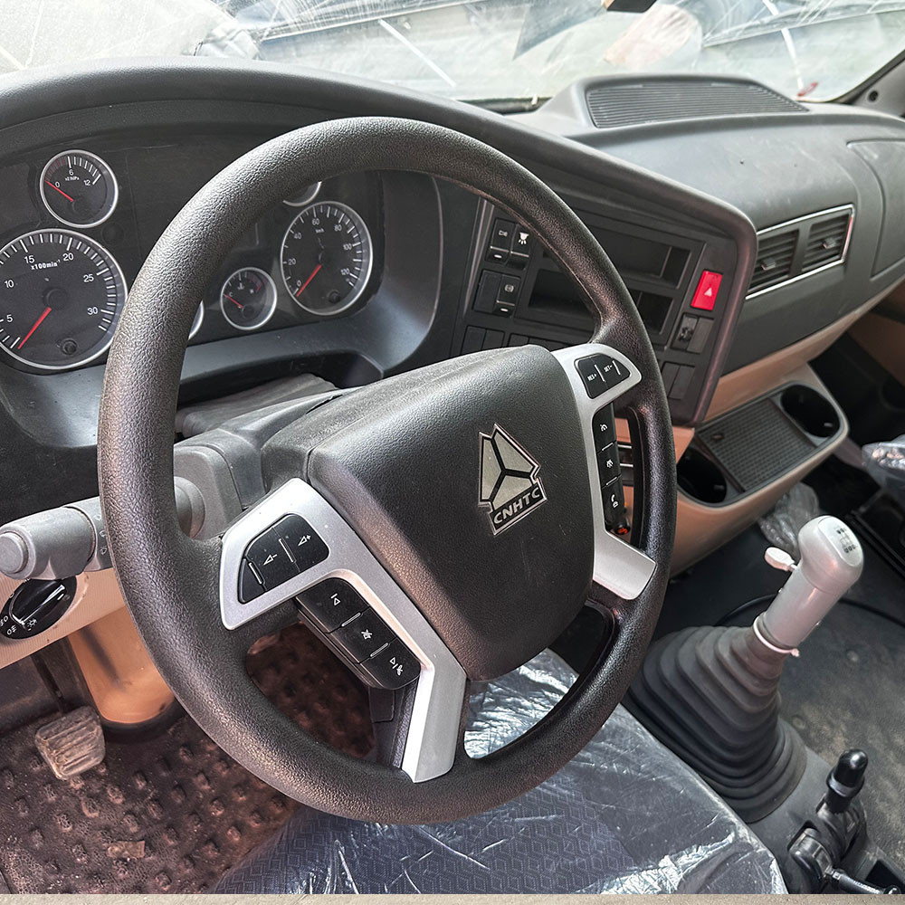 Steering wheel and dashboard close-up of HOWO NX 6x4 400HP tractor truck