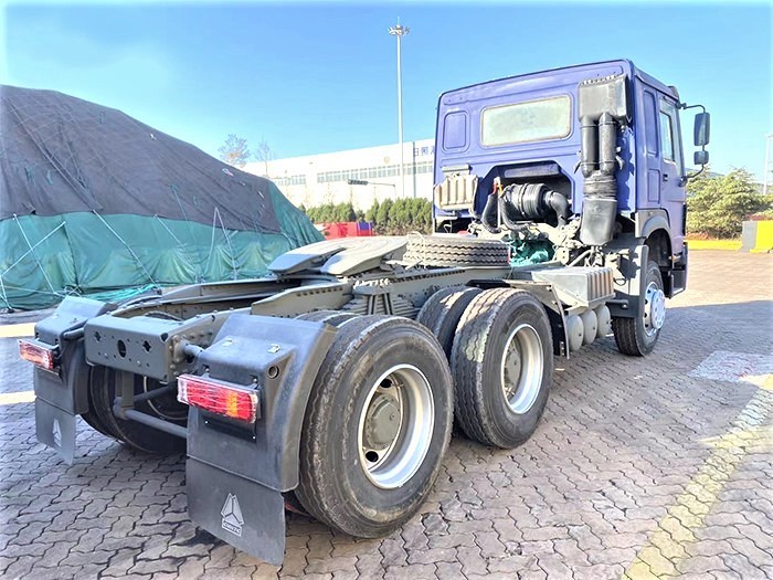 HOWO T7H 430HP 6x4 Tractor Truck rear 3/4 view showing drivetrain and reinforced frame