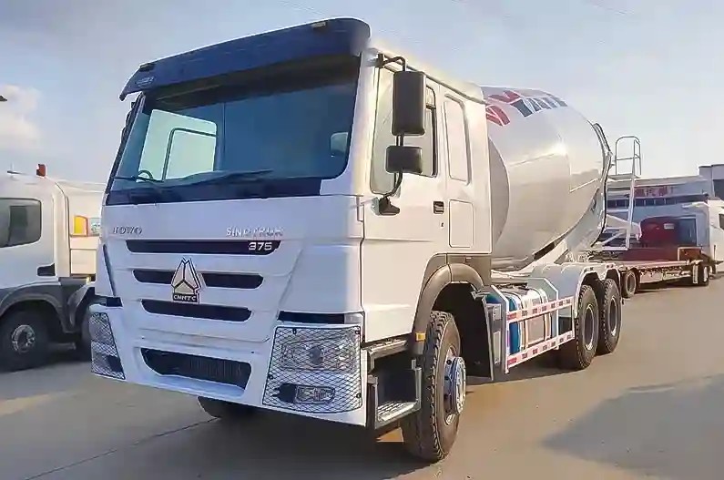 Howo 375HP 6x4 concrete mixer truck front three quarter view highlighting chassis and mixer drum