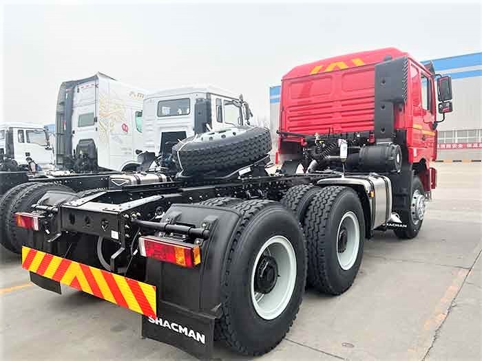 Shacman F3000 6x4 heavy duty tractor truck rear three quarter view showing fifth wheel and rear frame
