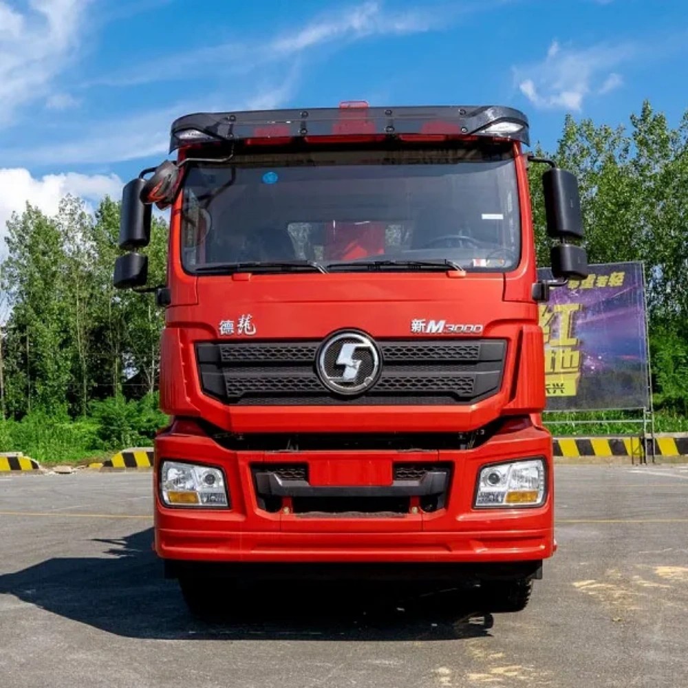 Shacman M3000 8x4 heavy duty truck mounted crane front view showing reinforced cab and crane boom