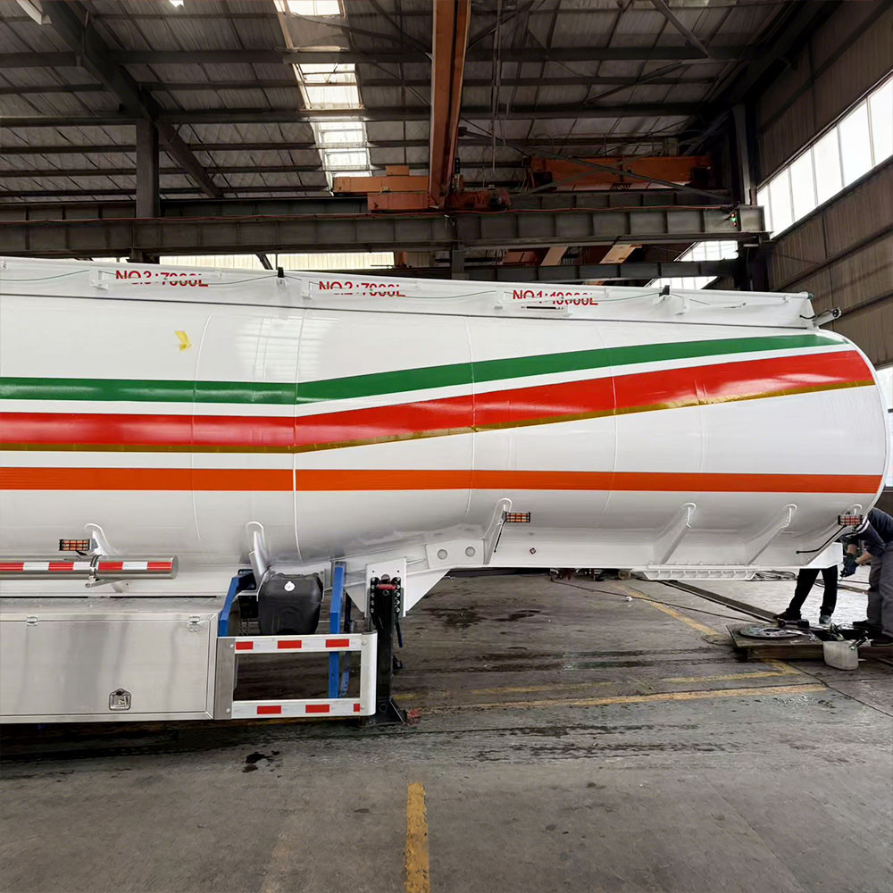 3 axle 45,000L aluminum fuel tanker semi trailer side view showing lightweight aluminum tank and suspension system
