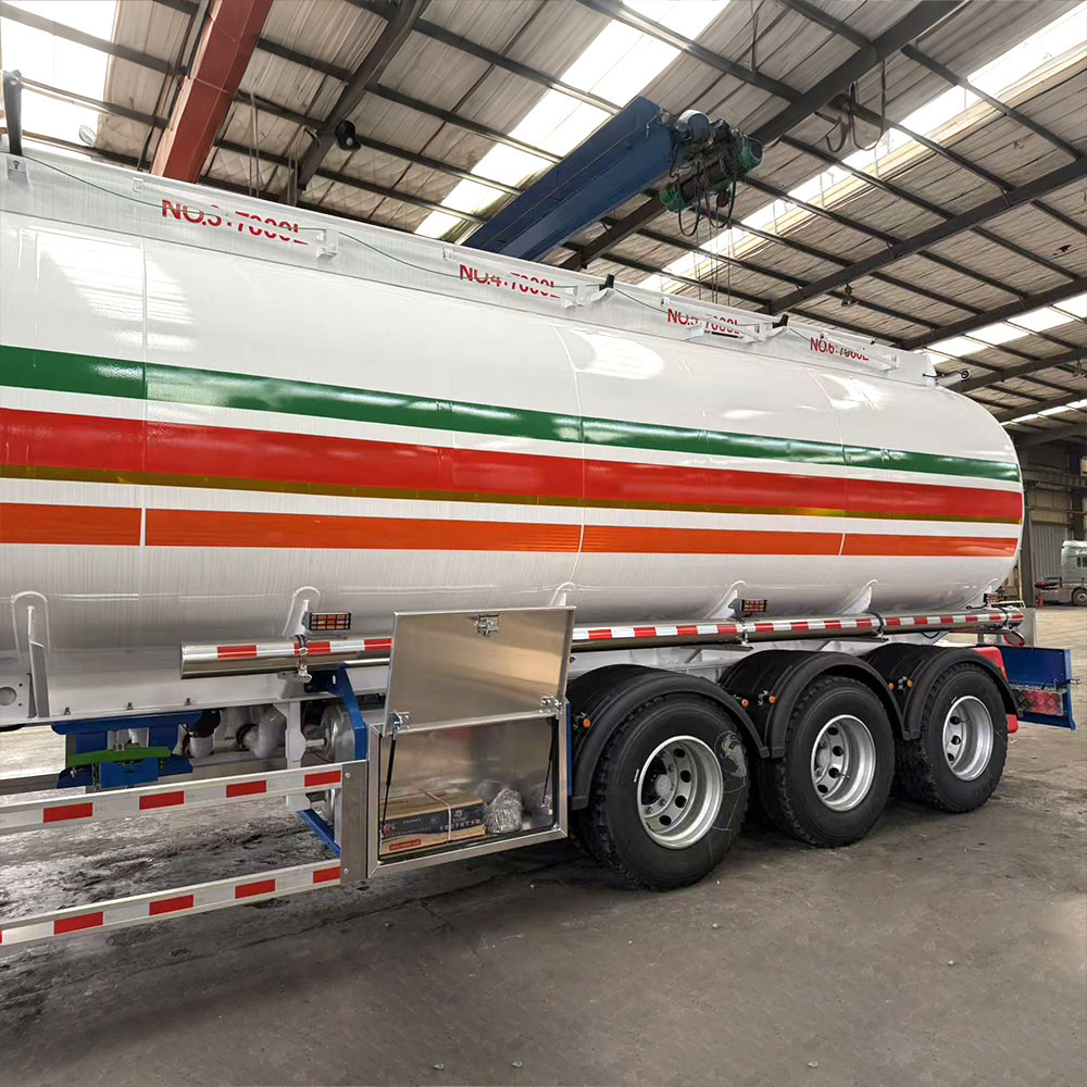 3 axle 45,000L aluminum fuel tanker semi trailer side view showing lightweight aluminum tank and suspension system