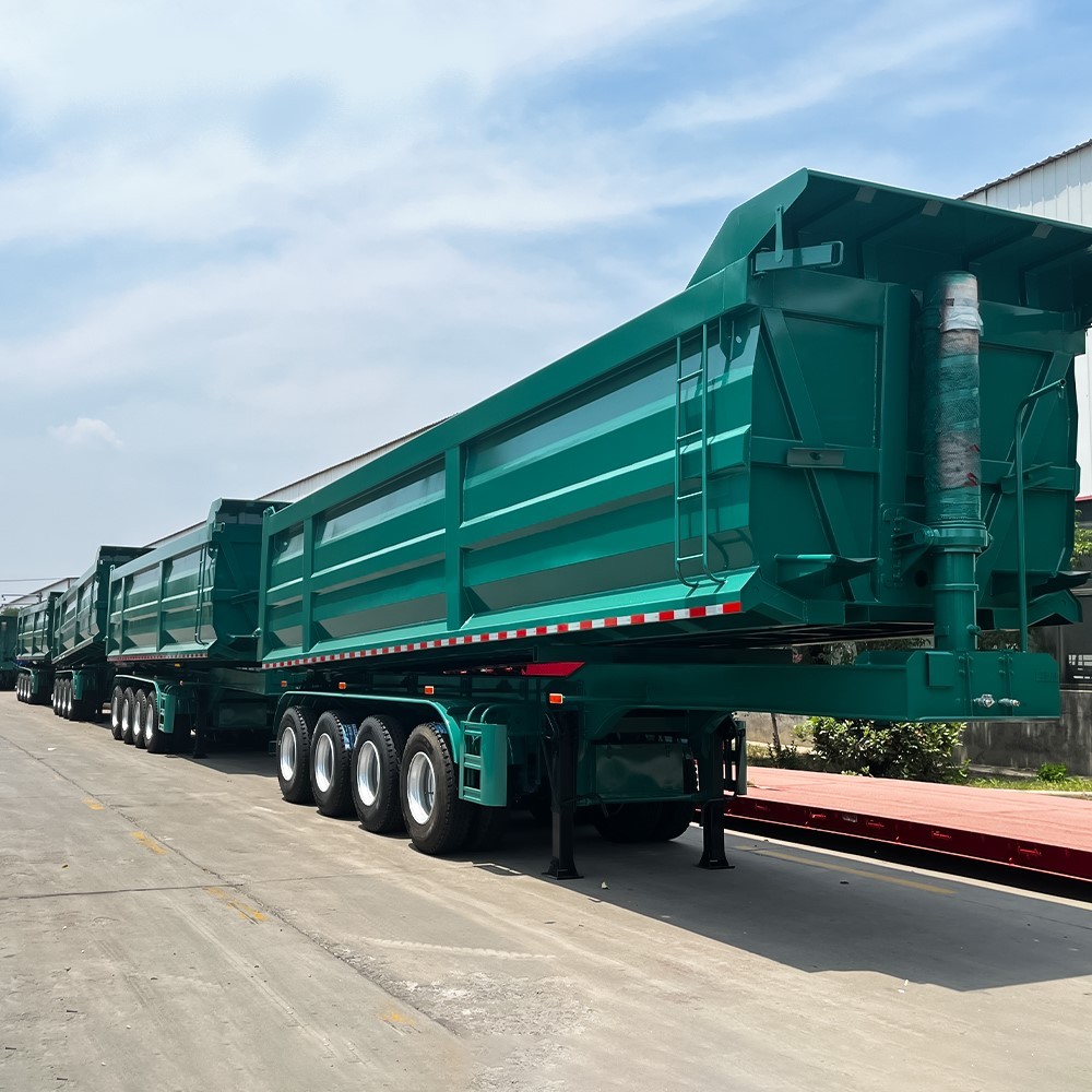 4 axle 35CBM tipper semi trailer rear three quarter view showing discharge tailgate and heavy duty frame