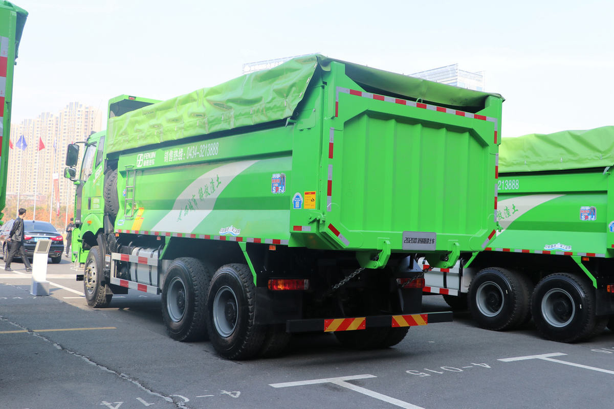 FAW J6P 6×4 dump truck rear three quarter view showing tailgate and hydraulic lifting system