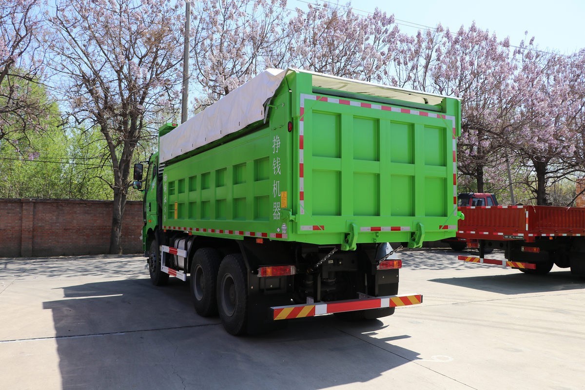FAW J6P 6×4 dump truck rear three quarter view showing tailgate and hydraulic lifting system
