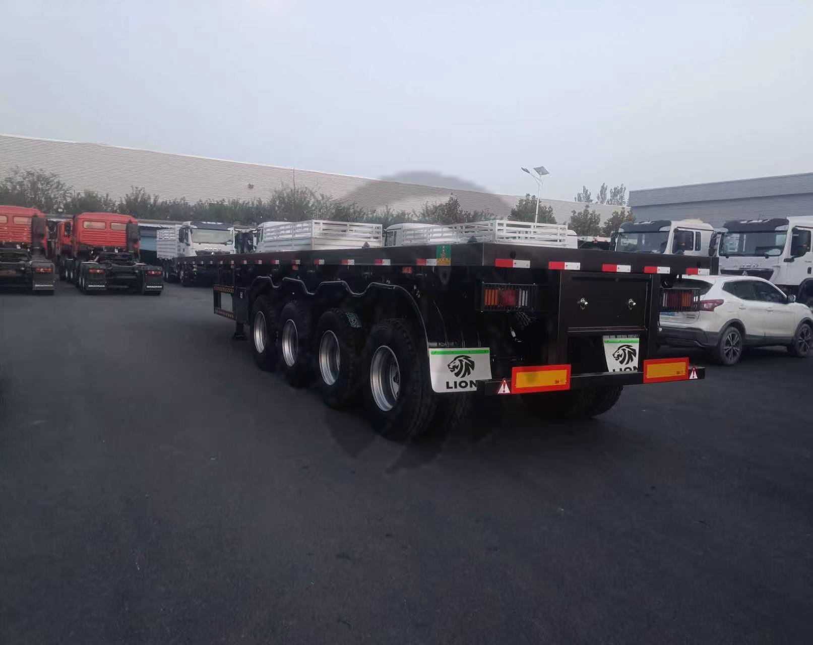 b486602b07ecab44882388d61e0af5a3 70 Ton 4 Axle Flatbed Trailer