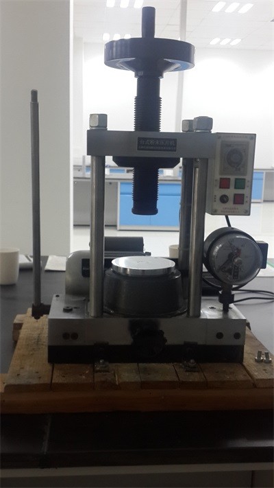 Powder compressing machine Powder compressing machine