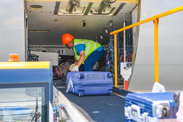 Carrying luggage bags and suitcases at the airport……