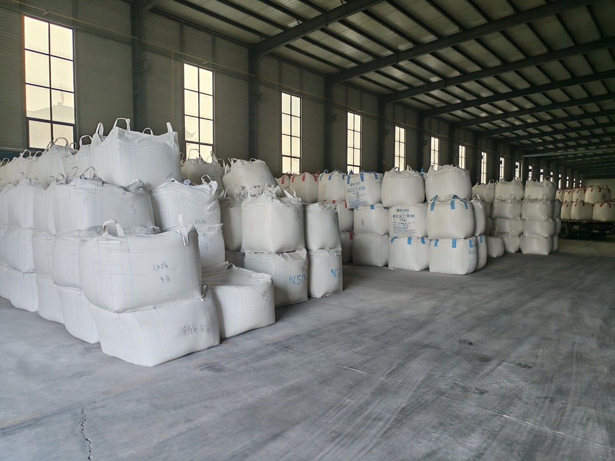 1787383470949688869702746112.jpg Engineered quartz slabs standing upright on A-frame racks in a slab factory warehouse, the starting point of any quartz slab price comparison