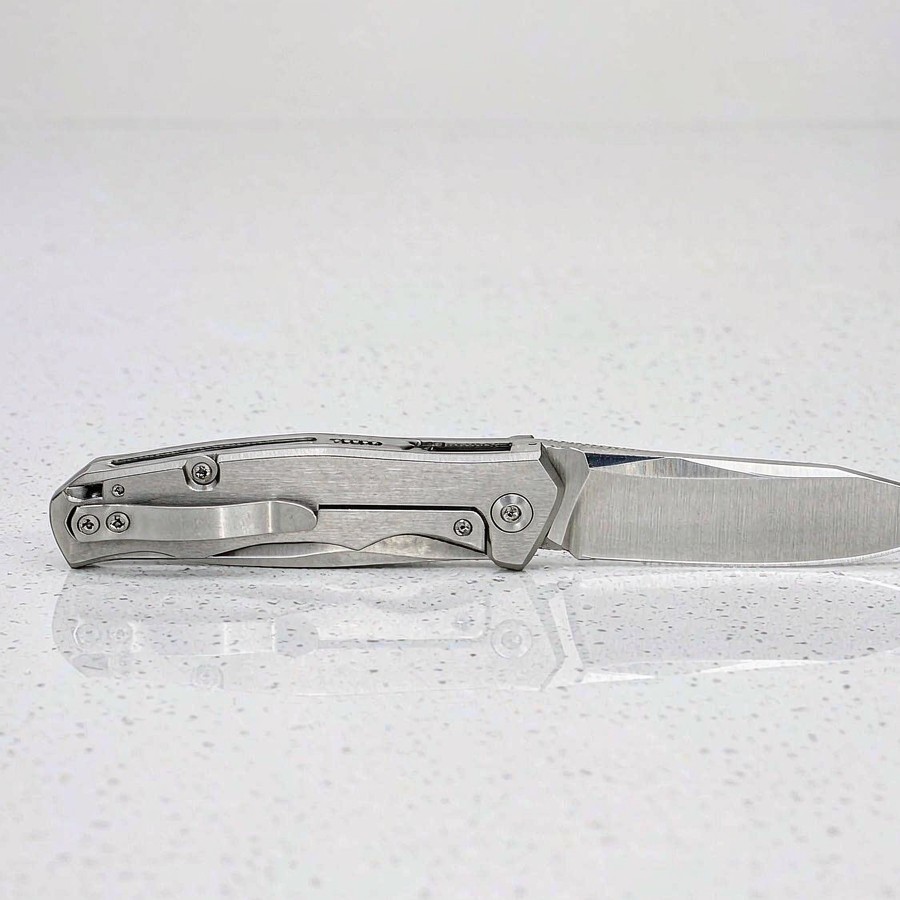 Steel blade resting harmlessly on anti-scratch quartz countertop surface without leaving a mark