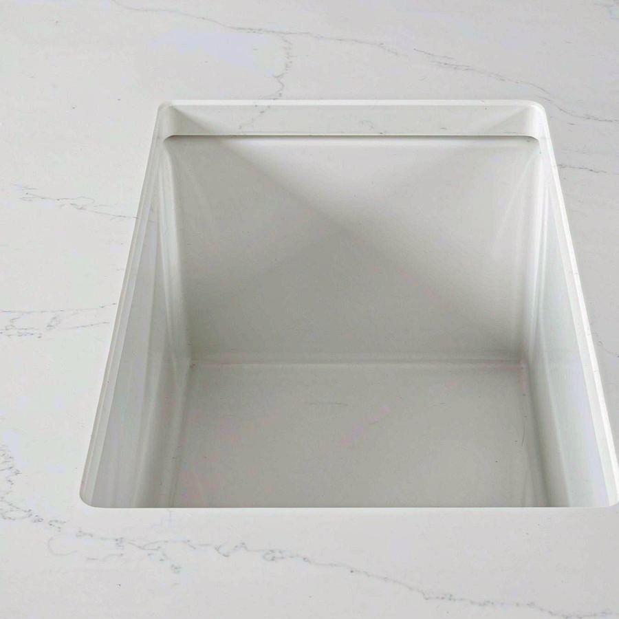 Undermount sink cutout in waterproof quartz stone countertop with polished edges and faucet holes