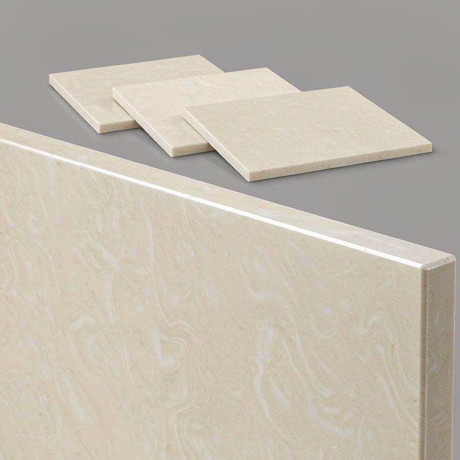 1789896185960227958543949824.jpg Close-up of an engineered quartz slab edge profile next to cream and ivory colour sample chips