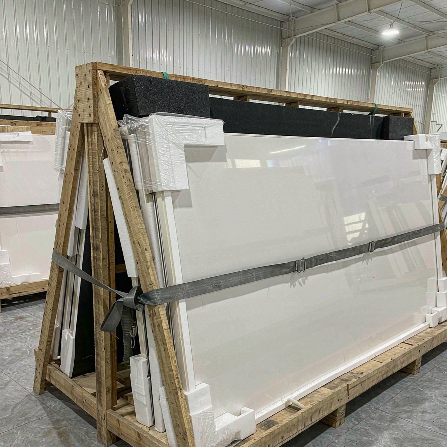 1789975730960561593138708480.jpg Packed engineered quartz slabs in wooden A-frame export crates staged in a factory warehouse for a quartz vs quartzite project order