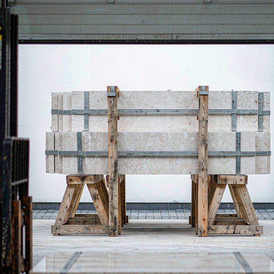 Finished engineered quartz sheets in different jumbo quartz slab sizes banded and ready for packing