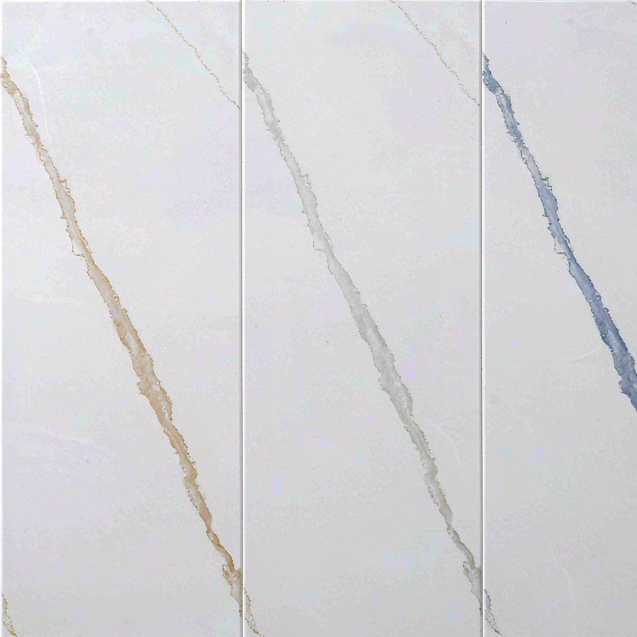 Three engineered quartz slab samples side by side showing white bases with gold, grey and blue veining