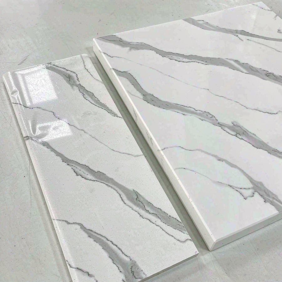 Quartz and laminate countertop samples side by side on a table
