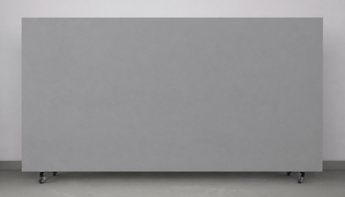 Neutral light grey quartz slab with minimal veining on a factory A-frame