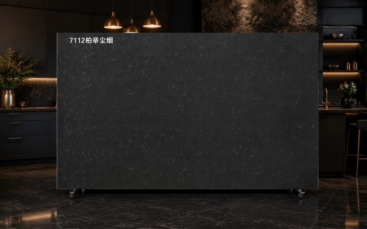 Dark quartz slab with waterfall island and integrated sink in a commercial style kitchen